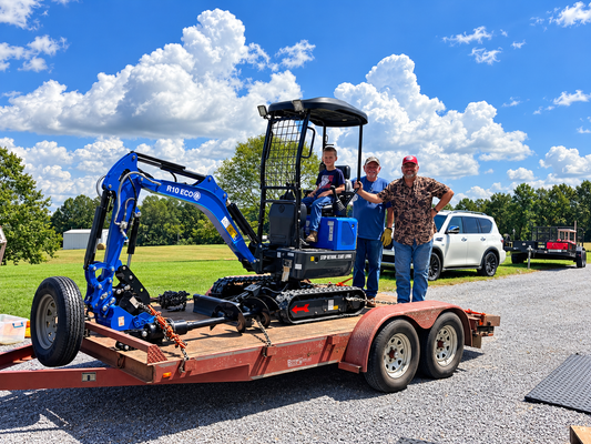Tom P with his son and grandson taking delivery of a 2026 Rippa R10 Kubota mini excavator from Ironcrest Equipment in Alabama