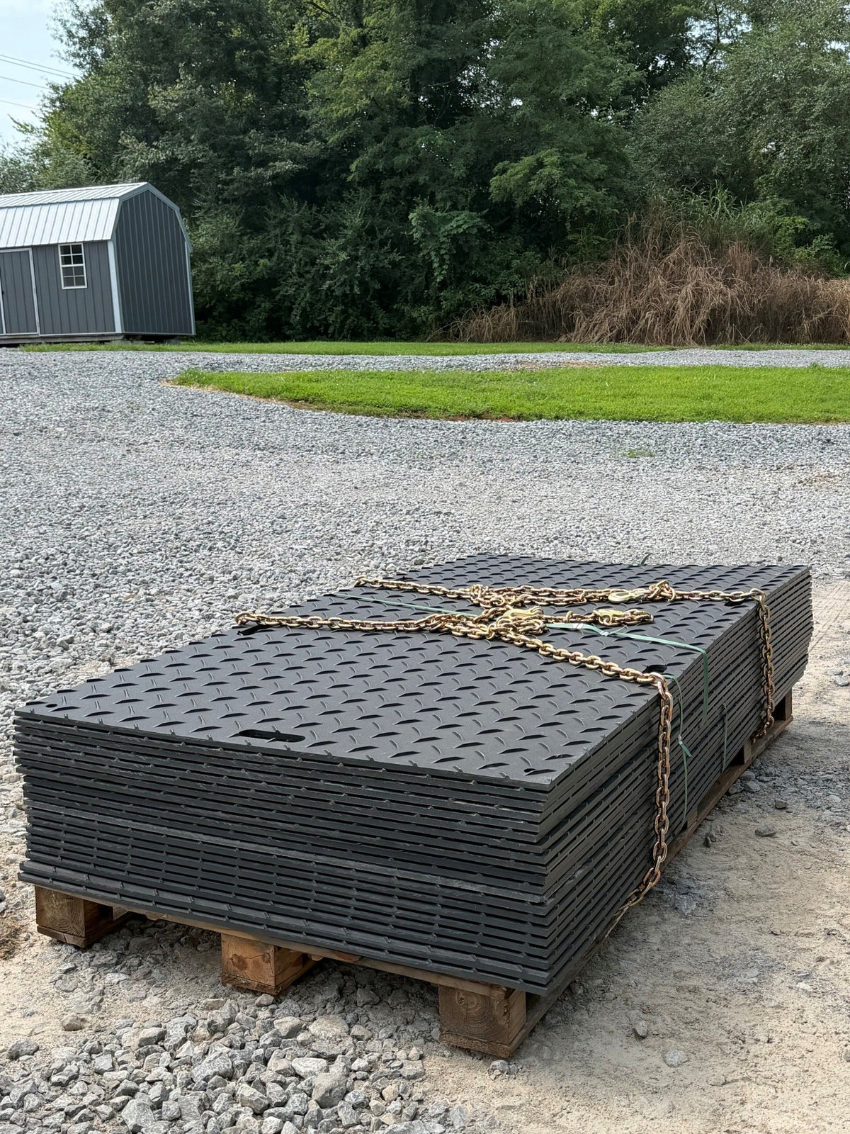 Heavy-duty BamaMats stacked and secured on a pallet
